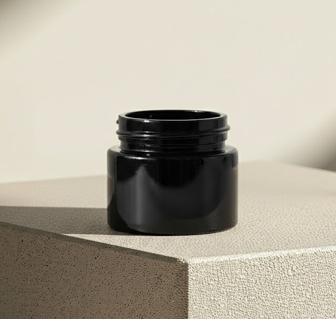 True Origin shilajit Miron jars placed in a clean minimal setting